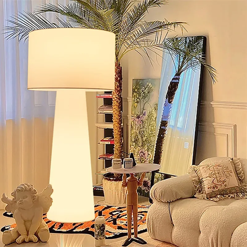 Contemporary arc floor lamp with fabric shade complementing modern interior design