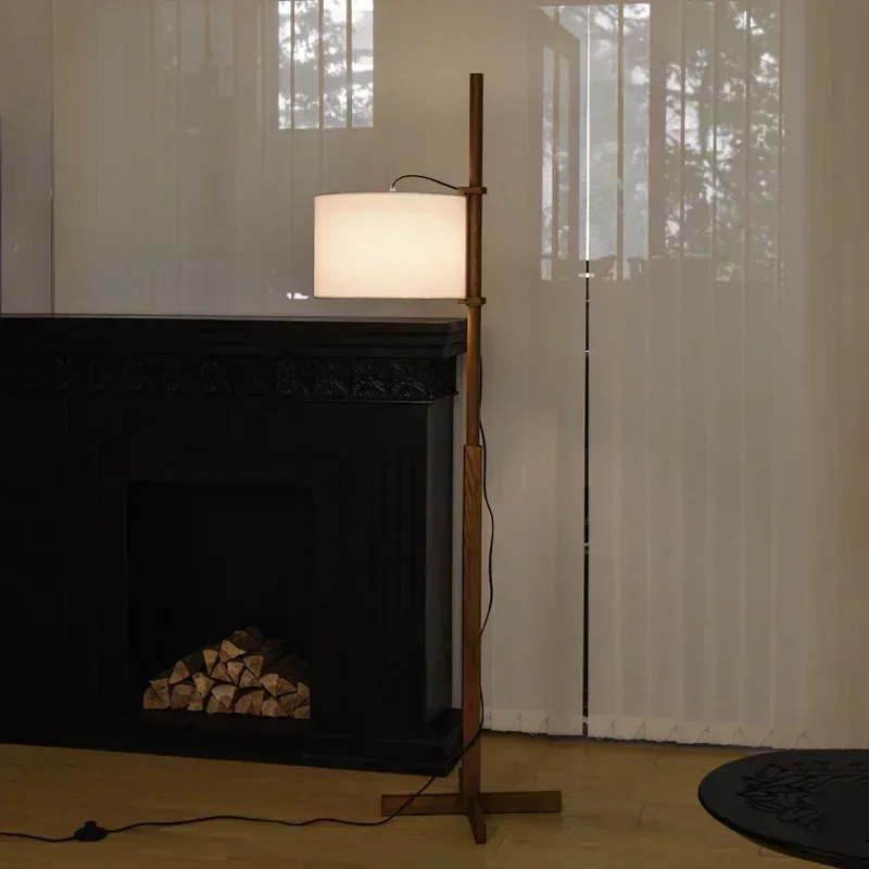 Wooden arc floor lamp with properly installed fabric shade