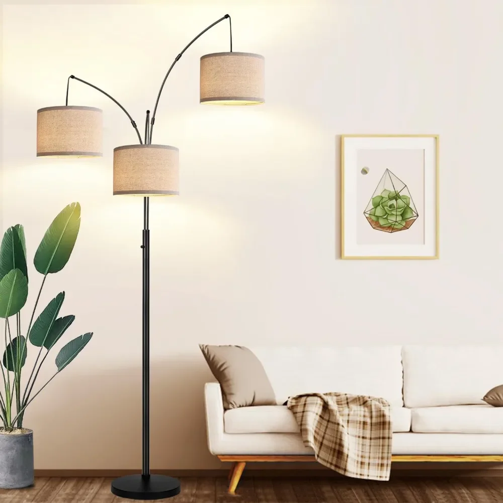 Arc floor lamp positioning over sofa with multiple light heads for optimal illumination