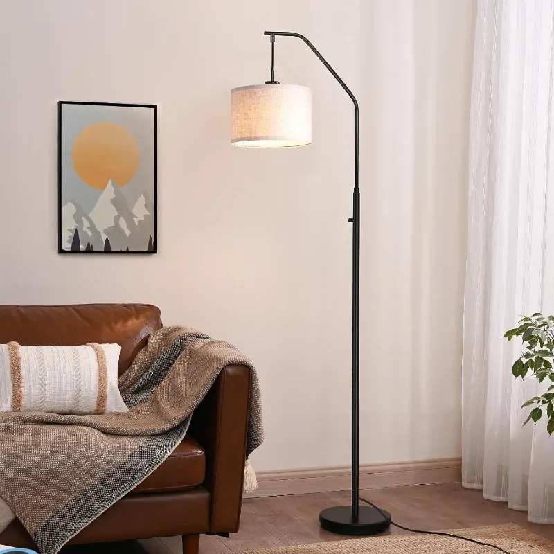 Modern arc floor lamp creating perfect illumination for a living room seating arrangement