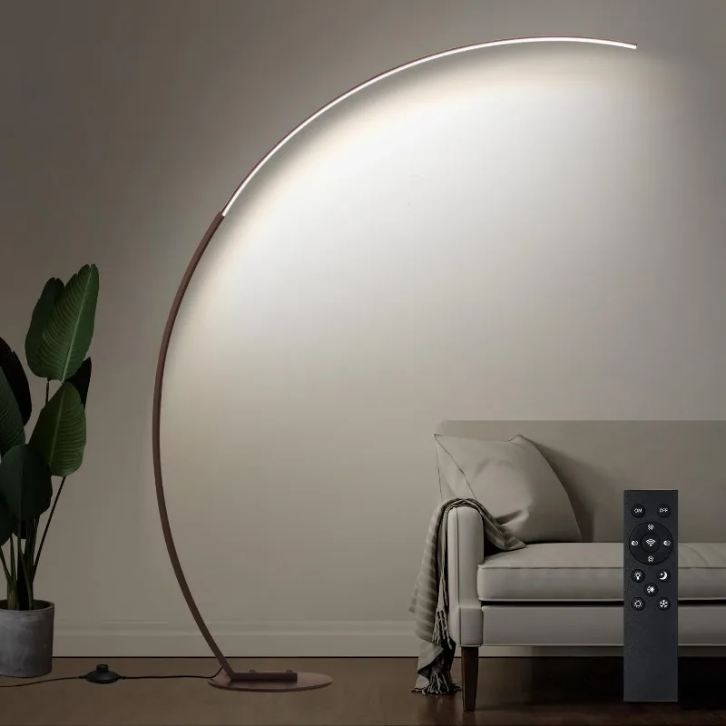 Modern gold arc floor lamp with elegant proportions for versatile room placement
